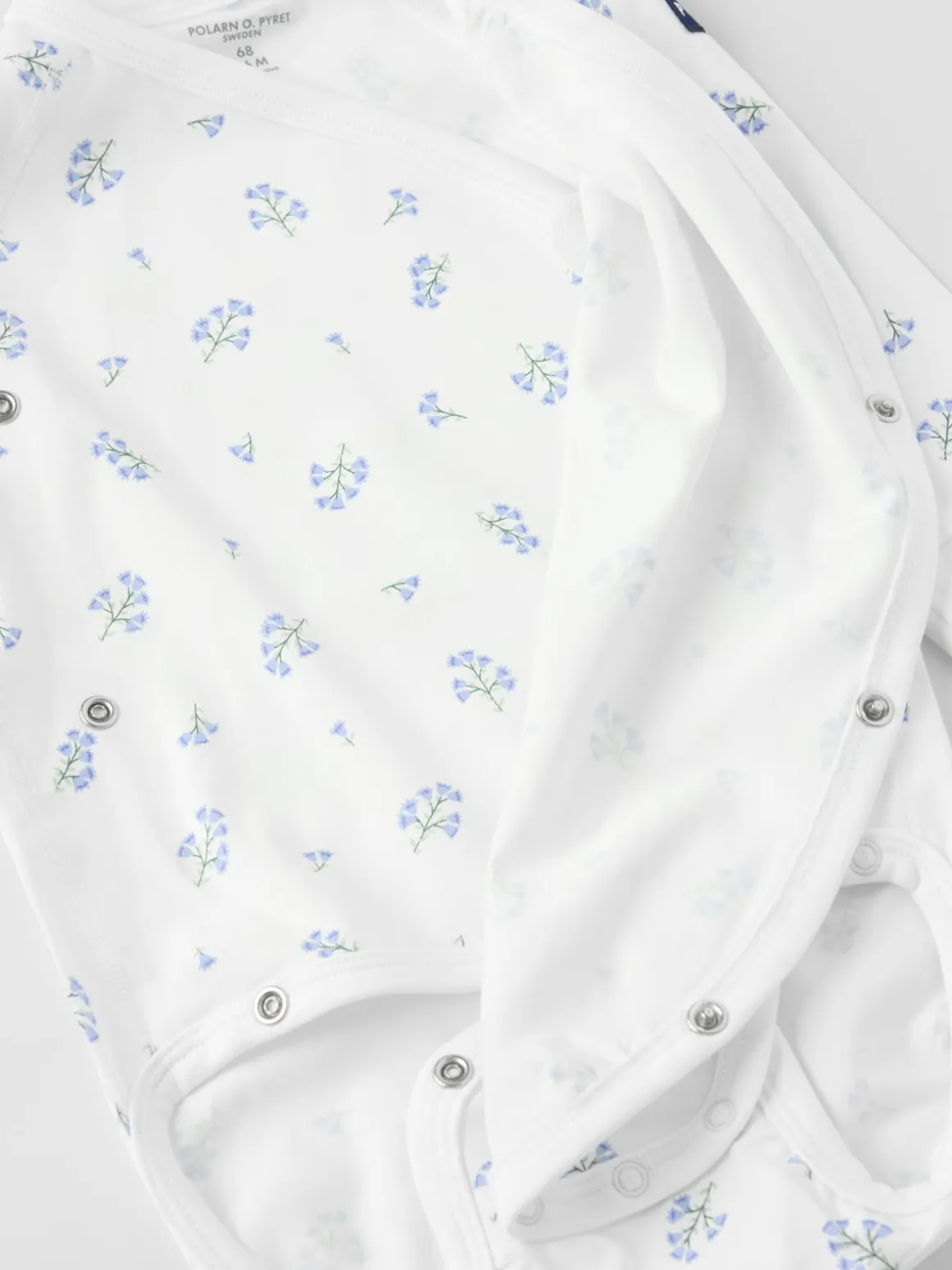 Förlängningsbar omlottbody blommig