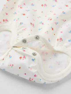 Långärmad body blommig
