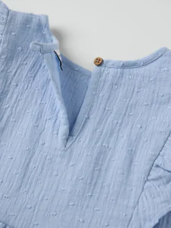 Vävd blus med volanger prickig